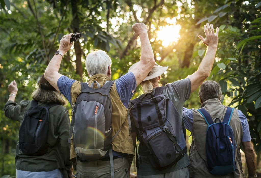 group-of-senior-adults-trekking-in-the-forest.jpg